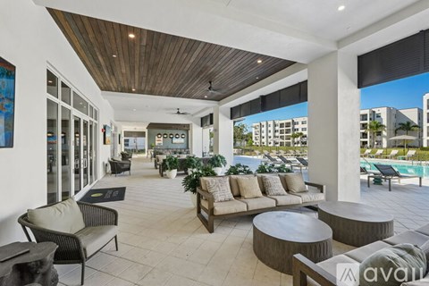 A patio area with a table and chairs.