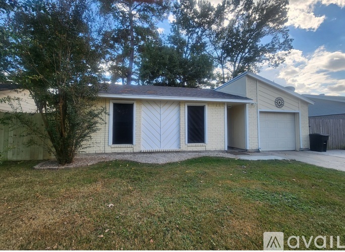 A two-story house with a garage is for sale.