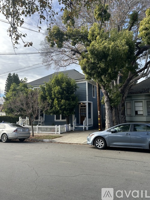 A house with a car parked in front of it.