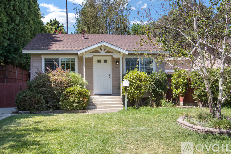 A house with a white door and a small porch.