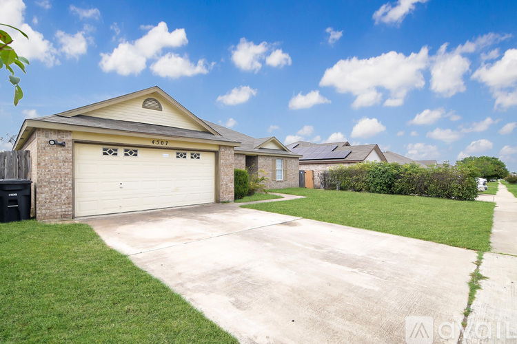 A house with a driveway and garage is for sale.