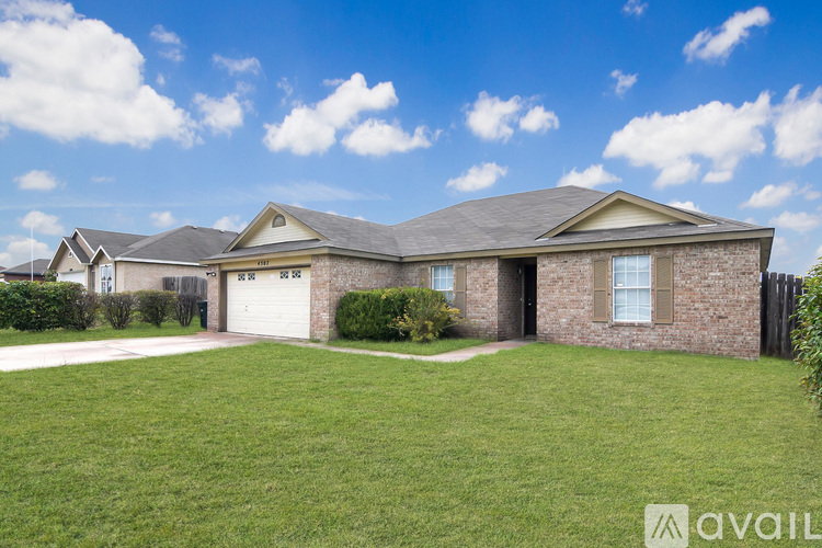 A house with a garage is for sale.