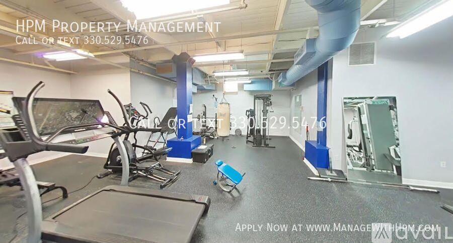 A gym with a sign that says HPM Property Management.