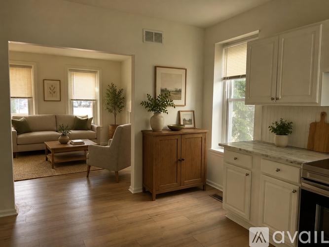 A living room with a couch, chair, and a coffee table.