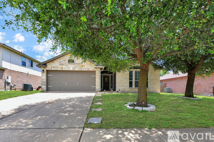A house with a tree in front of it.
