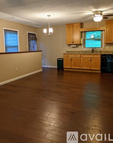 A kitchen with wooden cabinets and a countertop.