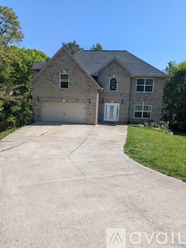 A house with a driveway in front of it.
