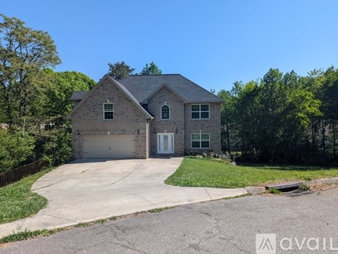 A house with a garage is available for sale.