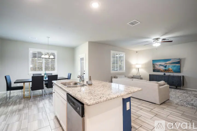A kitchen with a dining table and chairs is available.