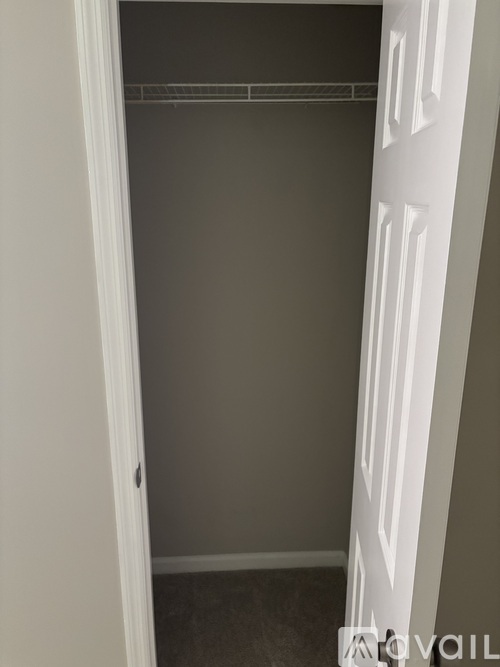 A white door with a white frame and a white handle.
