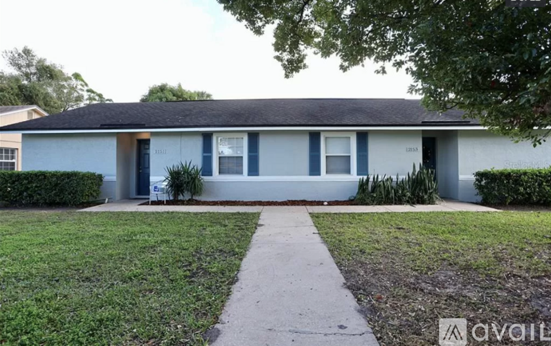 A house with a blue front door and a white front porch.