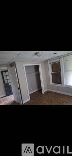 A room with a door and a window.