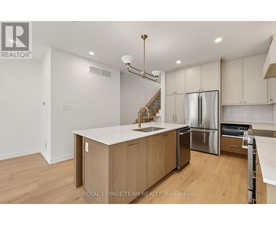 A modern kitchen with wooden cabinets and stainless steel appliances.