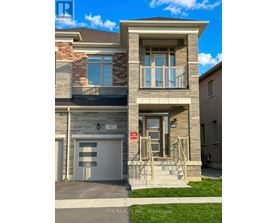 A two-story house with a garage is for sale.