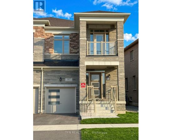 A two-story house with a garage is for sale.
