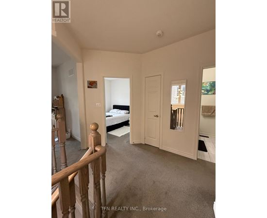A bedroom with a bed, dresser, and mirror.
