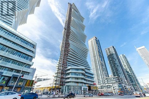 A cityscape with a tall building under construction in the center.