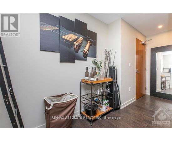 A room with a wine rack and a bag on the floor.