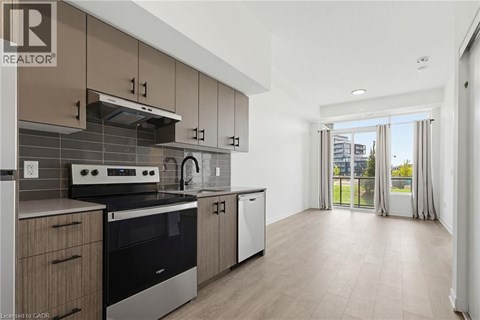 A modern kitchen with a stove top oven and a dishwasher.