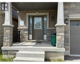A house with a brown door and a sign that says "LIVING ROOM LOTS".