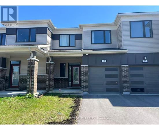 A modern two-story house with a garage is for sale.