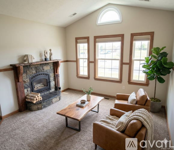 A living room with a fireplace and a couch.