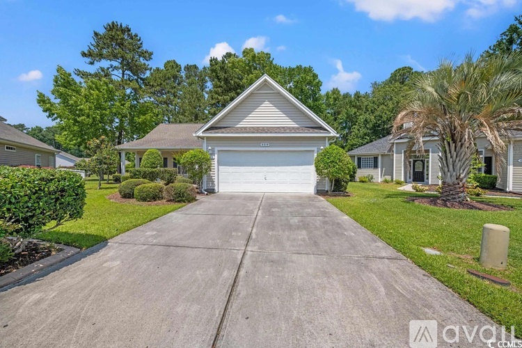A house with a driveway in front of it.