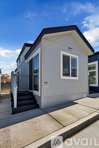 A small house with the number 50 on the front door.
