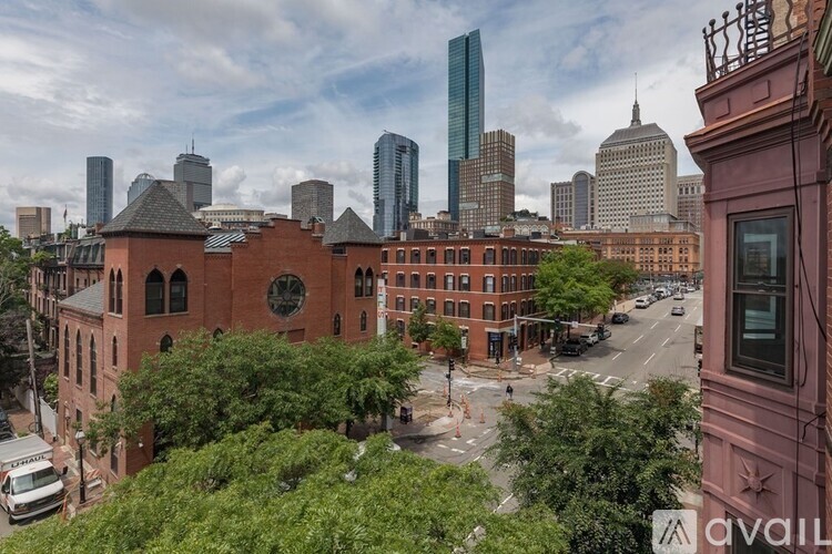 A cityscape with a mix of old and new buildings.