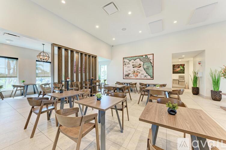A modern dining room with wooden furniture and a large painting on the wall.