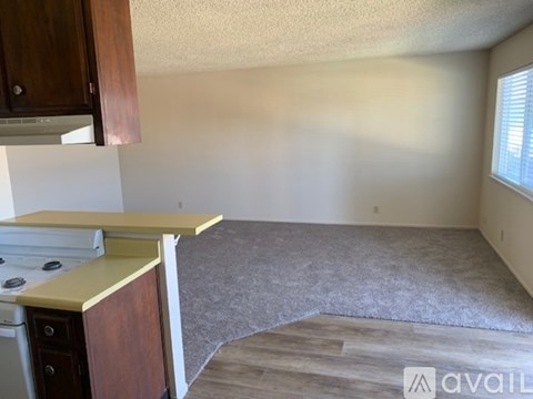 A kitchen area with a stove and a countertop.