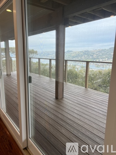 A balcony with a view of the cityscape.
