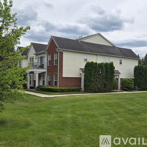 A house with a lawn in front of it.