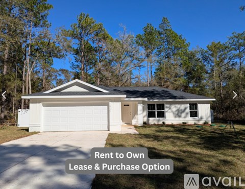 A house with a sign that says "Rent to Own Lease & Purchase Option".