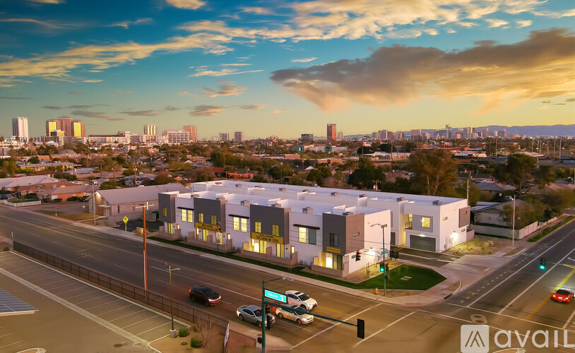 A modern building complex is available for rent in a city.