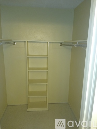 A white ladder is leaning against a wall in a room.