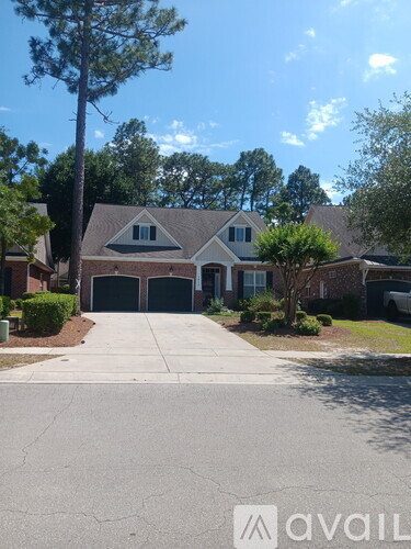 A house with a driveway in front of it.