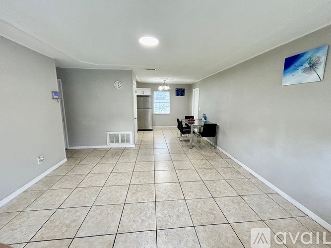 A house with a driveway in front of it is for sale.