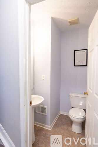 A small bathroom with a toilet and sink.