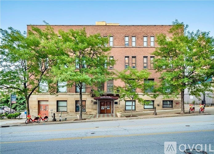 A building with a red bicycle parked in front of it.