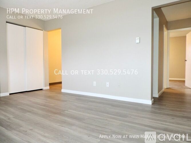 A room with HPM Property Management written on the wall.