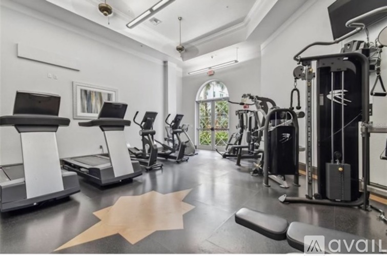 A well-equipped gym with treadmills, exercise bikes, and other fitness machines.