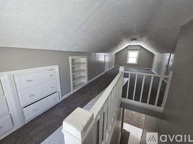 A room with a staircase leading to the second floor.