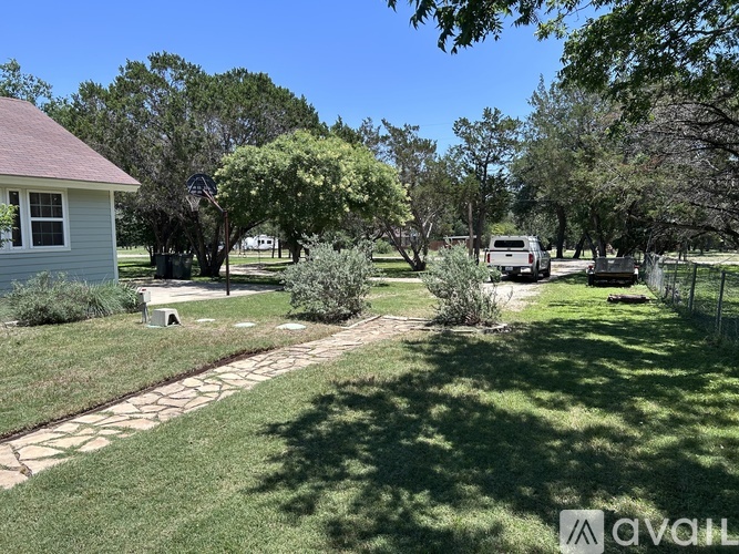 A house with a flag on the lawn.
