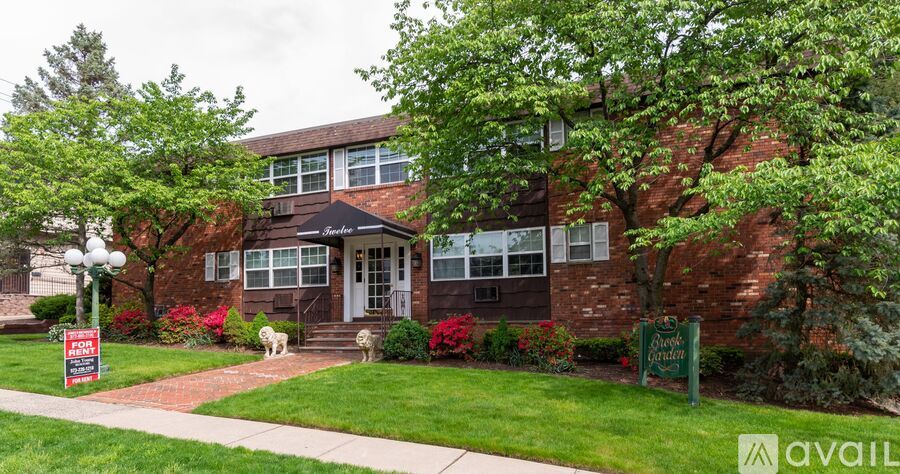 A house with a "For Sale" sign in front of it.