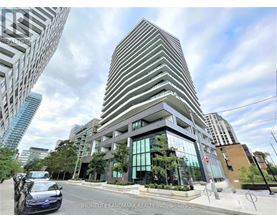 A modern building with a glass facade is the focal point of the image.
