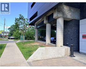 A concrete structure with a sign that says REALTOR in the upper left corner.