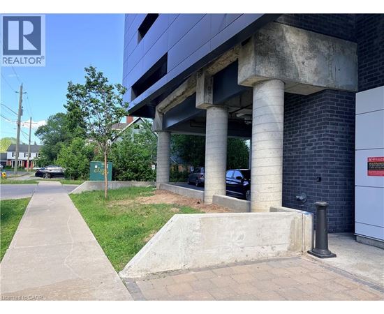A concrete structure with a sign that says REALTOR in the upper left corner.