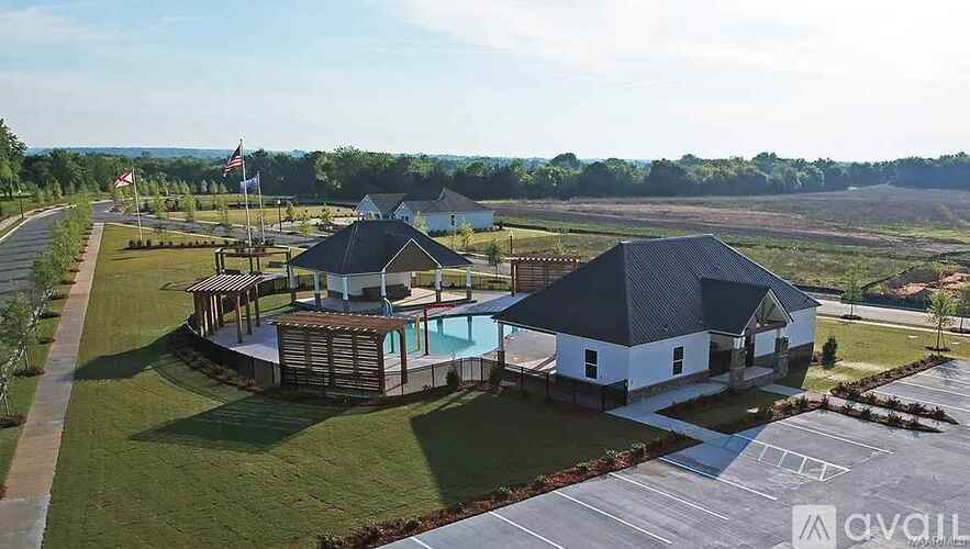 A large building with a pool in front of it.