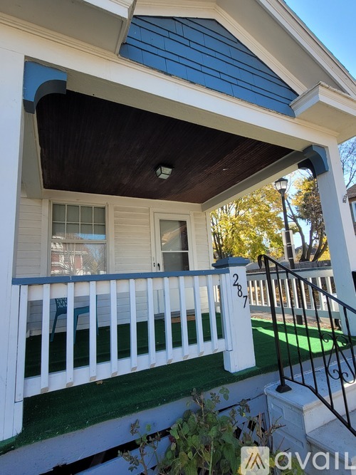 A house with a balcony and a number 2777 on the railing.